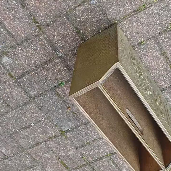 Vintage Brass Magazine Rack Gathering Outside an Inn