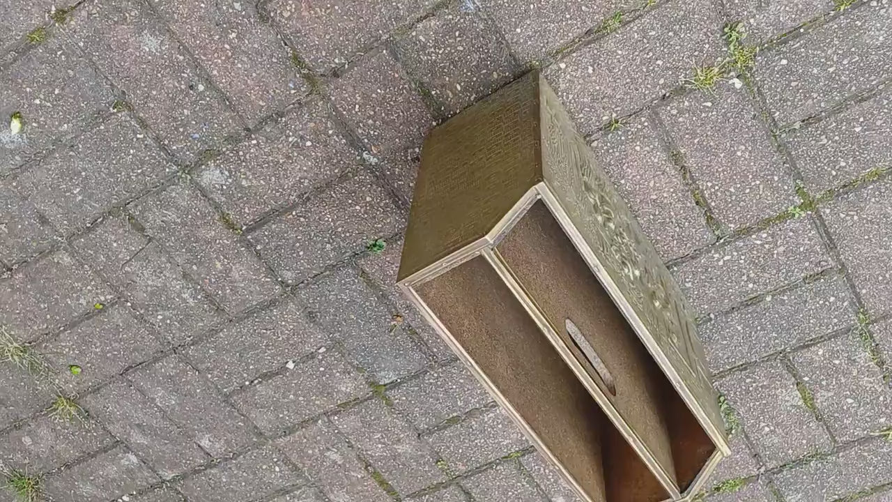 Vintage Brass Magazine Rack Gathering Outside an Inn
